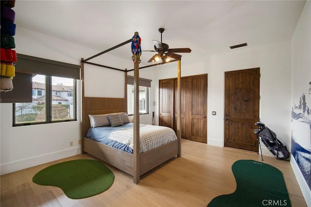 bedroom featuring ceiling fan and light wood-type flooring