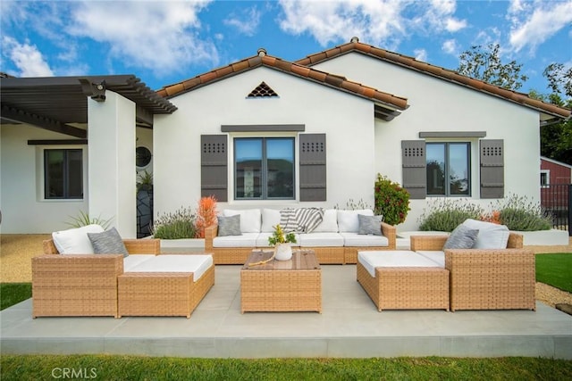 rear view of property with an outdoor hangout area