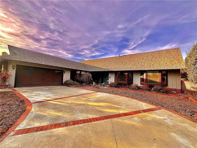 ranch-style home featuring a garage