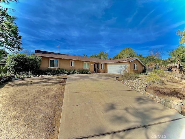 ranch-style home featuring a garage