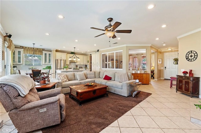 tiled living room featuring crown molding and ceiling fan