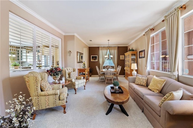 carpeted living room featuring crown molding, a healthy amount of sunlight, and an inviting chandelier