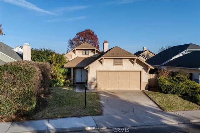 front facade featuring a garage and a front yard