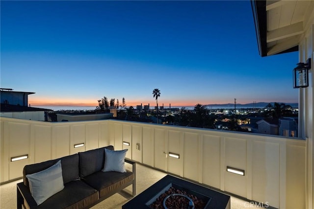 patio terrace at dusk with outdoor lounge area