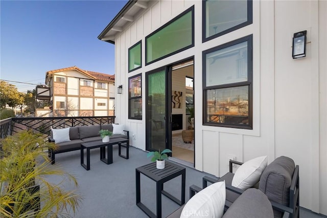 view of patio with a balcony and outdoor lounge area