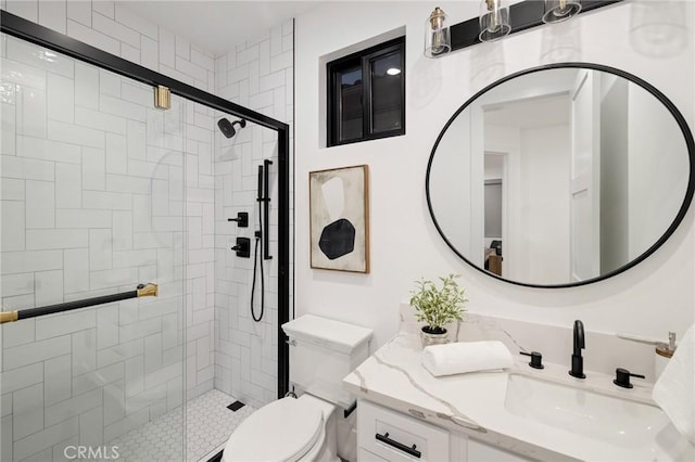 bathroom with vanity, toilet, and walk in shower