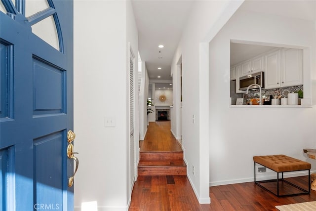 corridor featuring dark wood-type flooring