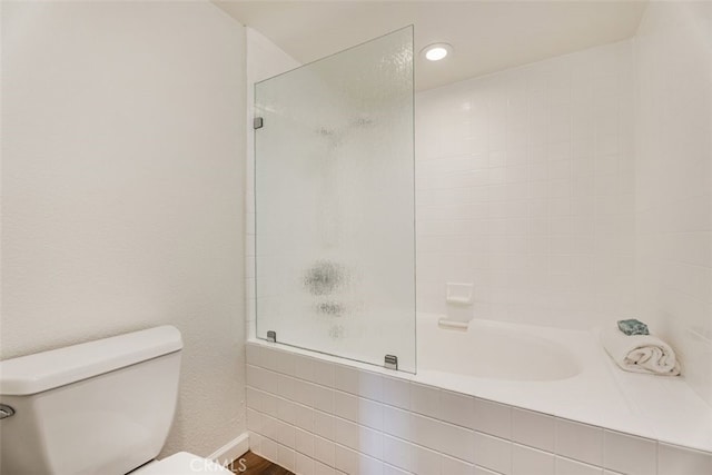 bathroom with hardwood / wood-style flooring and toilet