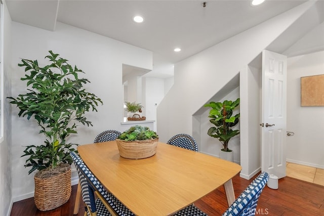 dining room with wood-type flooring