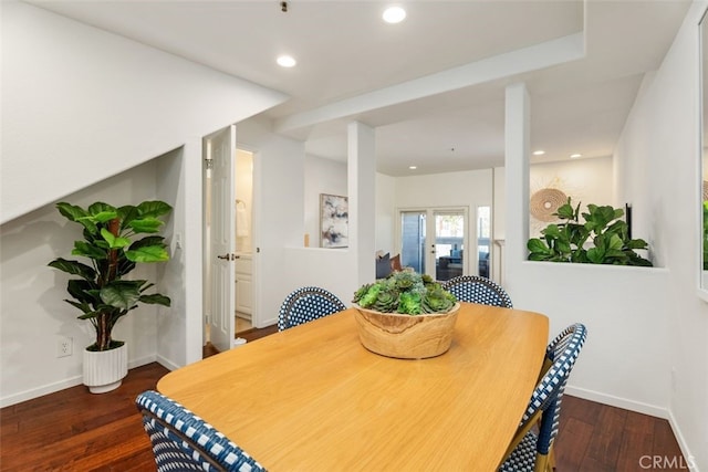 dining space featuring dark hardwood / wood-style floors