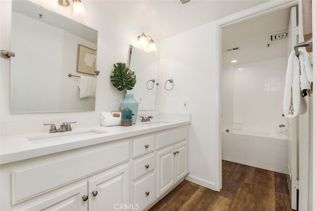 bathroom featuring vanity and hardwood / wood-style flooring