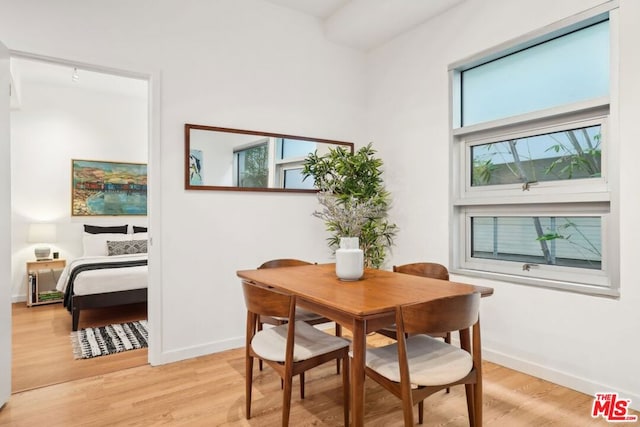 dining space featuring a healthy amount of sunlight and light wood-type flooring