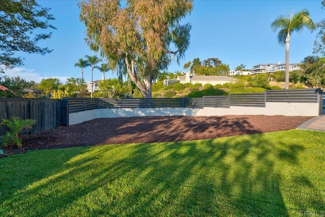 view of home's community featuring a lawn