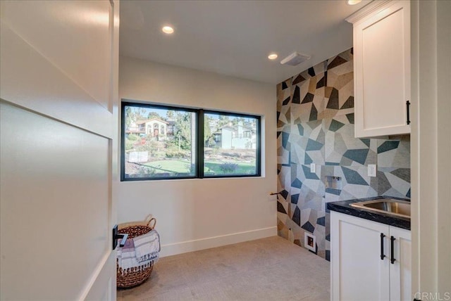 interior space featuring white cabinetry and tasteful backsplash