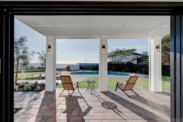 view of patio with a fenced in pool