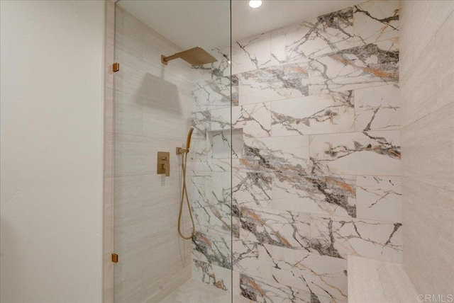 bathroom featuring tiled shower