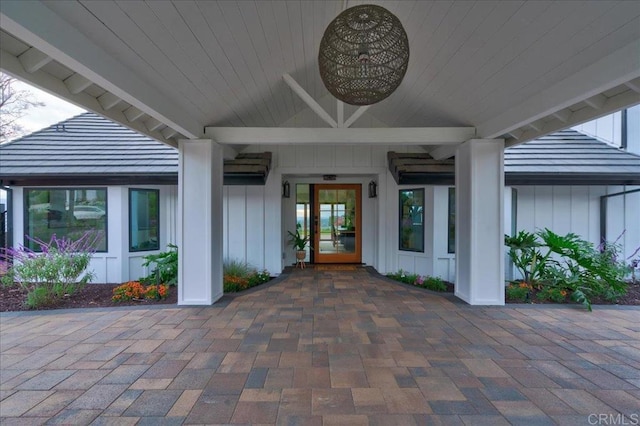 view of exterior entry featuring ceiling fan