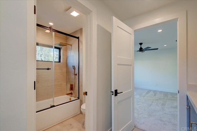 full bathroom with toilet, ceiling fan, vanity, and shower / bath combination with glass door