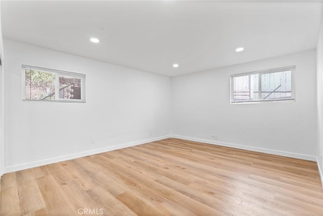 spare room featuring light wood-type flooring