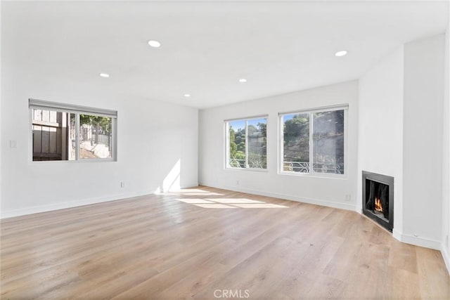 unfurnished living room featuring light hardwood / wood-style flooring