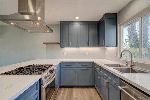 kitchen with sink, light hardwood / wood-style flooring, stainless steel appliances, light stone countertops, and island exhaust hood