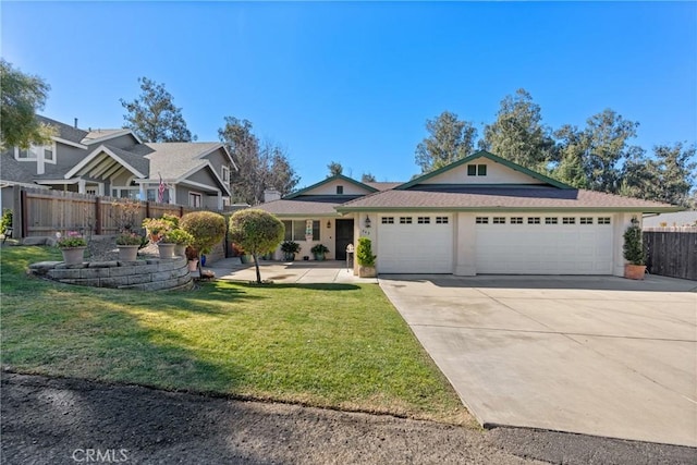 view of front of home with a garage and a front yard