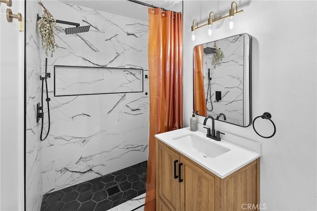 bathroom featuring vanity and curtained shower