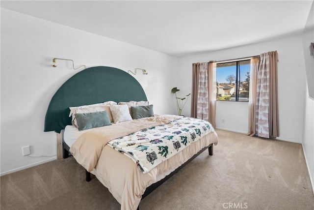 bedroom with light colored carpet