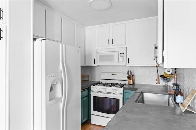 kitchen featuring white cabinetry, light wood-type flooring, and white appliances