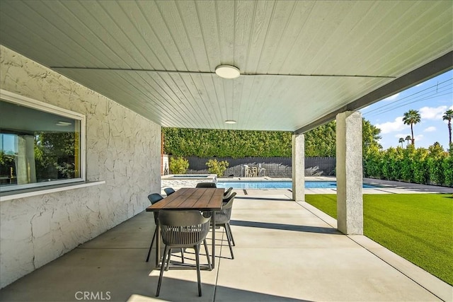 view of patio with a pool with hot tub