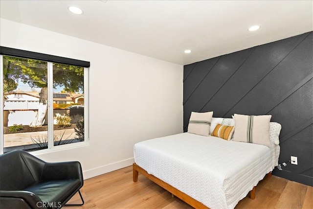 bedroom with light hardwood / wood-style flooring