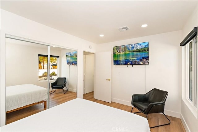 bedroom with hardwood / wood-style floors