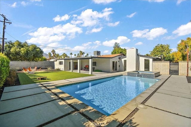 view of swimming pool with a lawn, a patio, central air condition unit, and an in ground hot tub