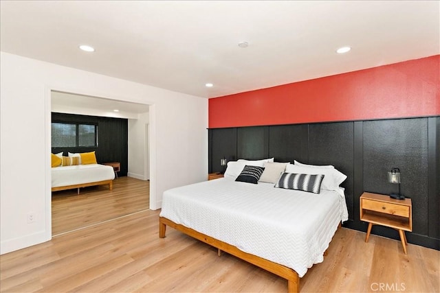 bedroom with hardwood / wood-style flooring