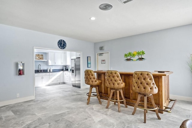 dining room featuring wet bar