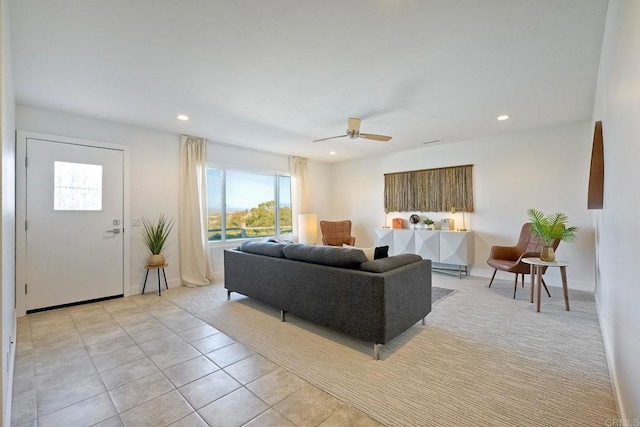 tiled living room featuring ceiling fan