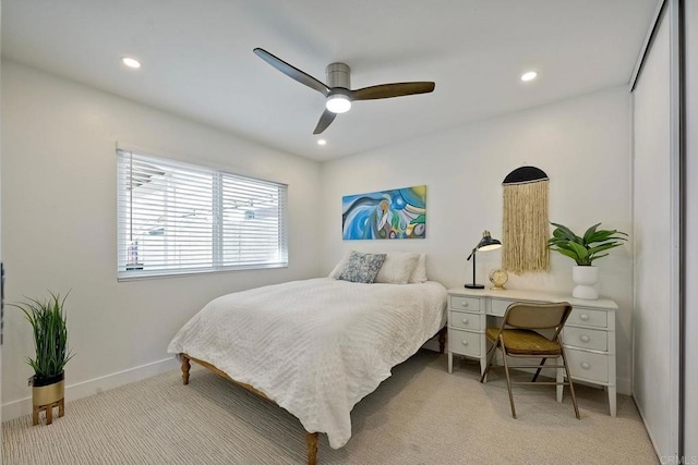 carpeted bedroom with ceiling fan