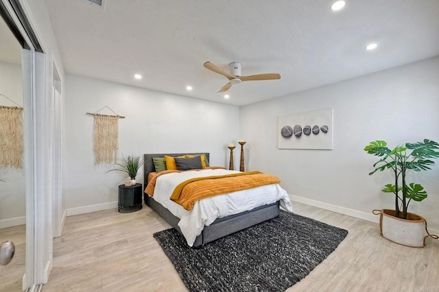 bedroom featuring ceiling fan and light wood-type flooring