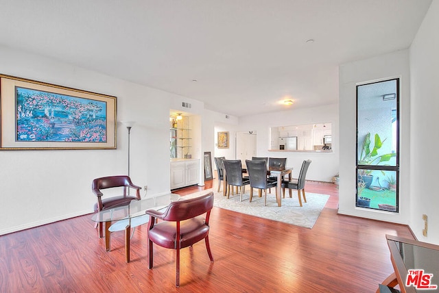 dining room with hardwood / wood-style flooring