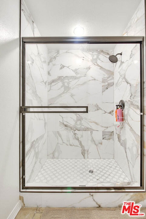 bathroom featuring an enclosed shower