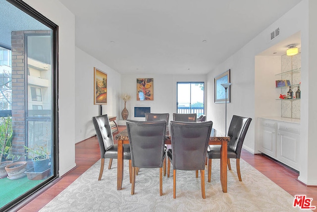 dining space with light wood-type flooring