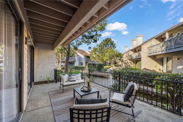 view of patio / terrace featuring a balcony and outdoor lounge area