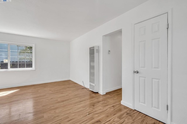 unfurnished room with light hardwood / wood-style floors