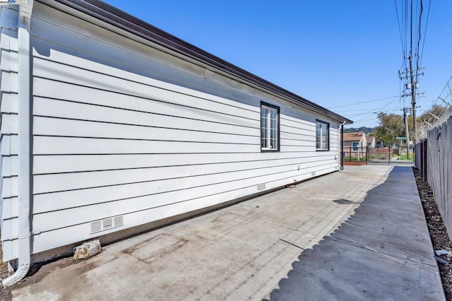 view of side of home featuring a patio area