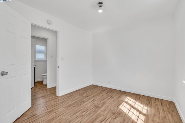 empty room with light wood-type flooring