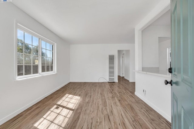 spare room featuring hardwood / wood-style floors