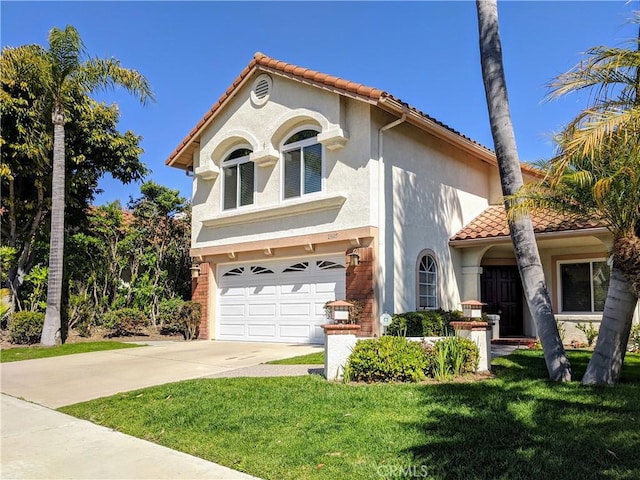 mediterranean / spanish-style house featuring a garage and a front yard