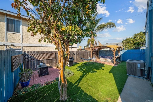 view of yard with a fire pit, a pergola, central AC, and a patio