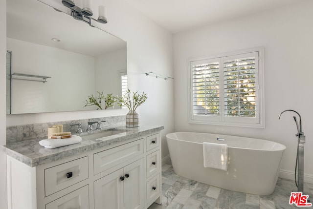 bathroom with vanity and a tub to relax in