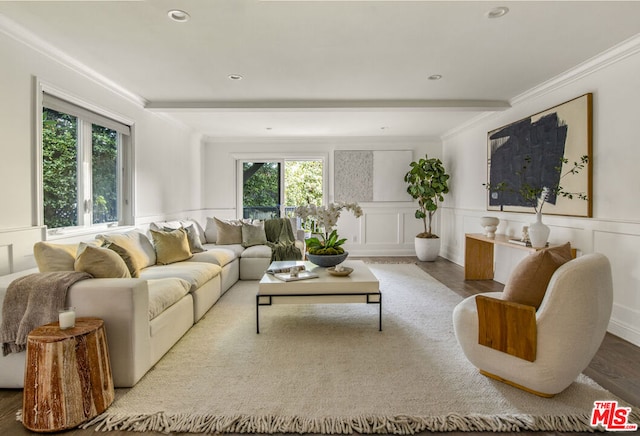 living room with beamed ceiling, crown molding, and light hardwood / wood-style flooring